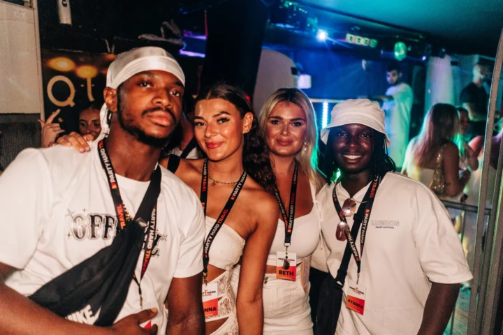 Group of reps enjoying Ayia Napa 2025 nightlife at Agenda White Party with Party Hard Travel event wristbands