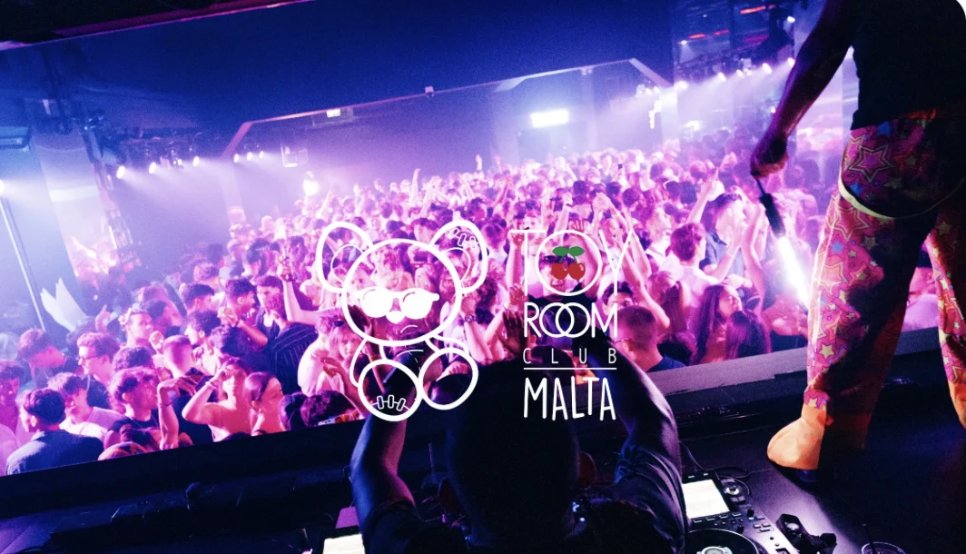 Toy Room Club Malta crowd view with logo and purple lights.