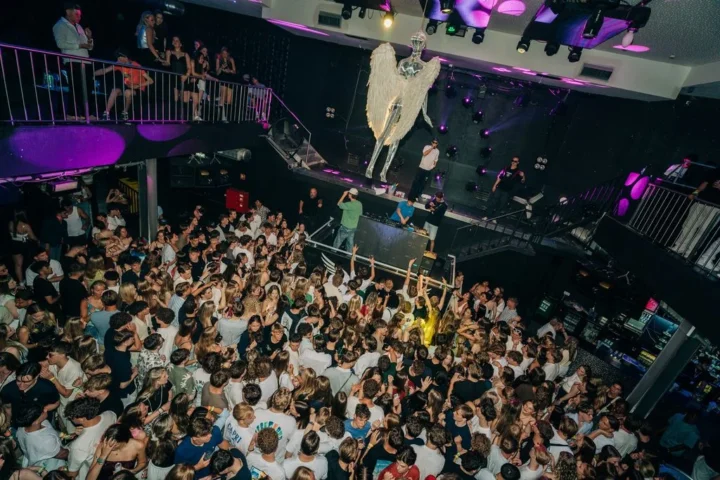 Packed dancefloor at Club Heaven, Albufeira as the crowd goes off under neon lights and huge party vibes.