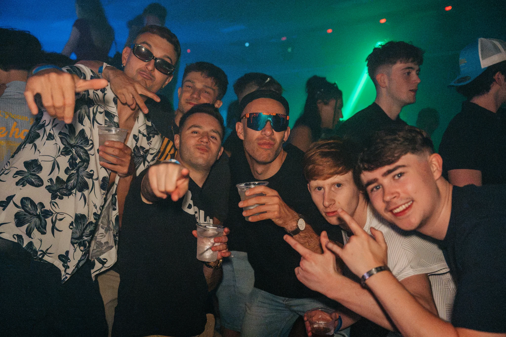Lads and girls posing together during a night out in Kavos