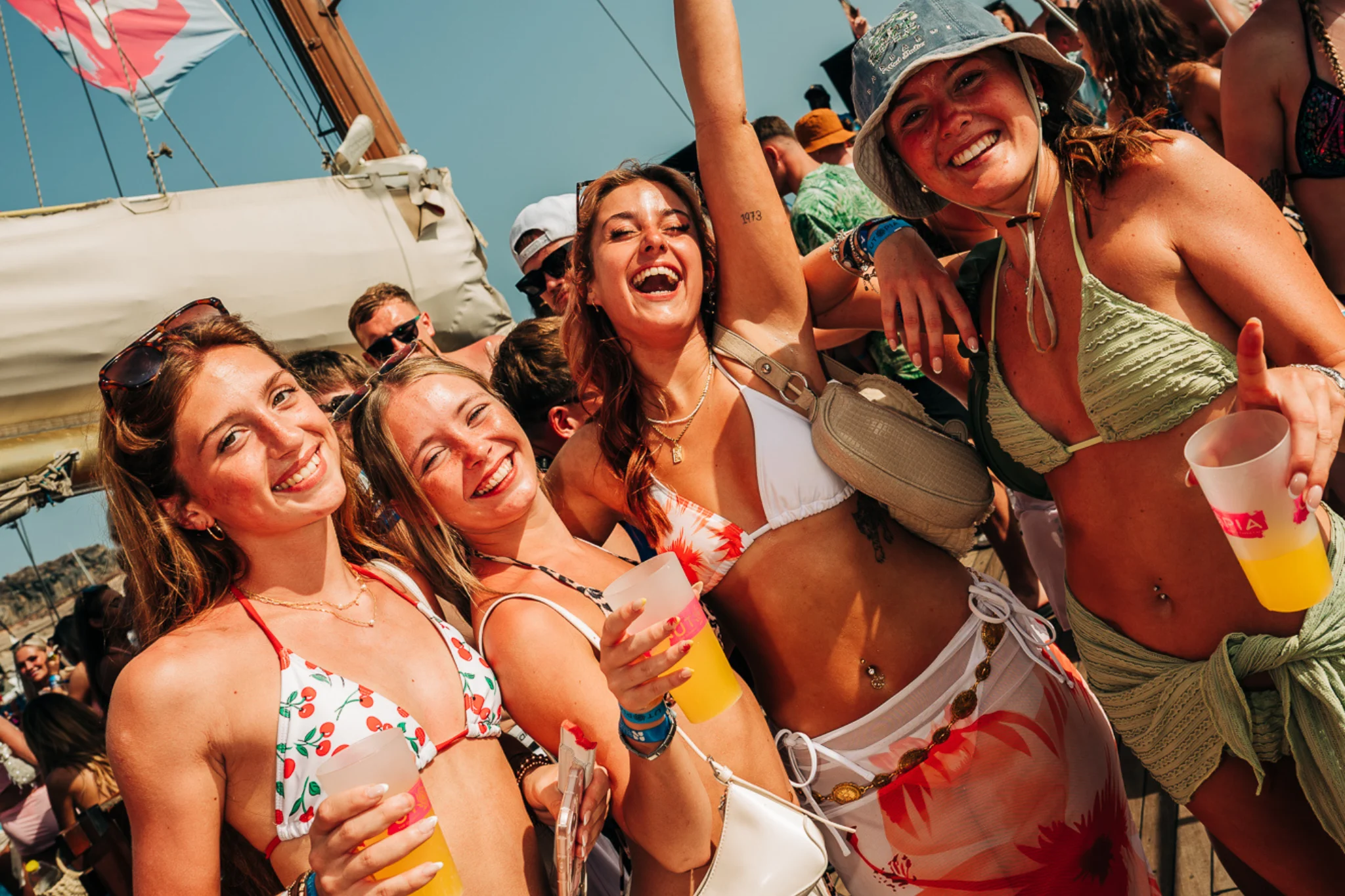 Group of girls posing together at a daytime boat party in Tenerife