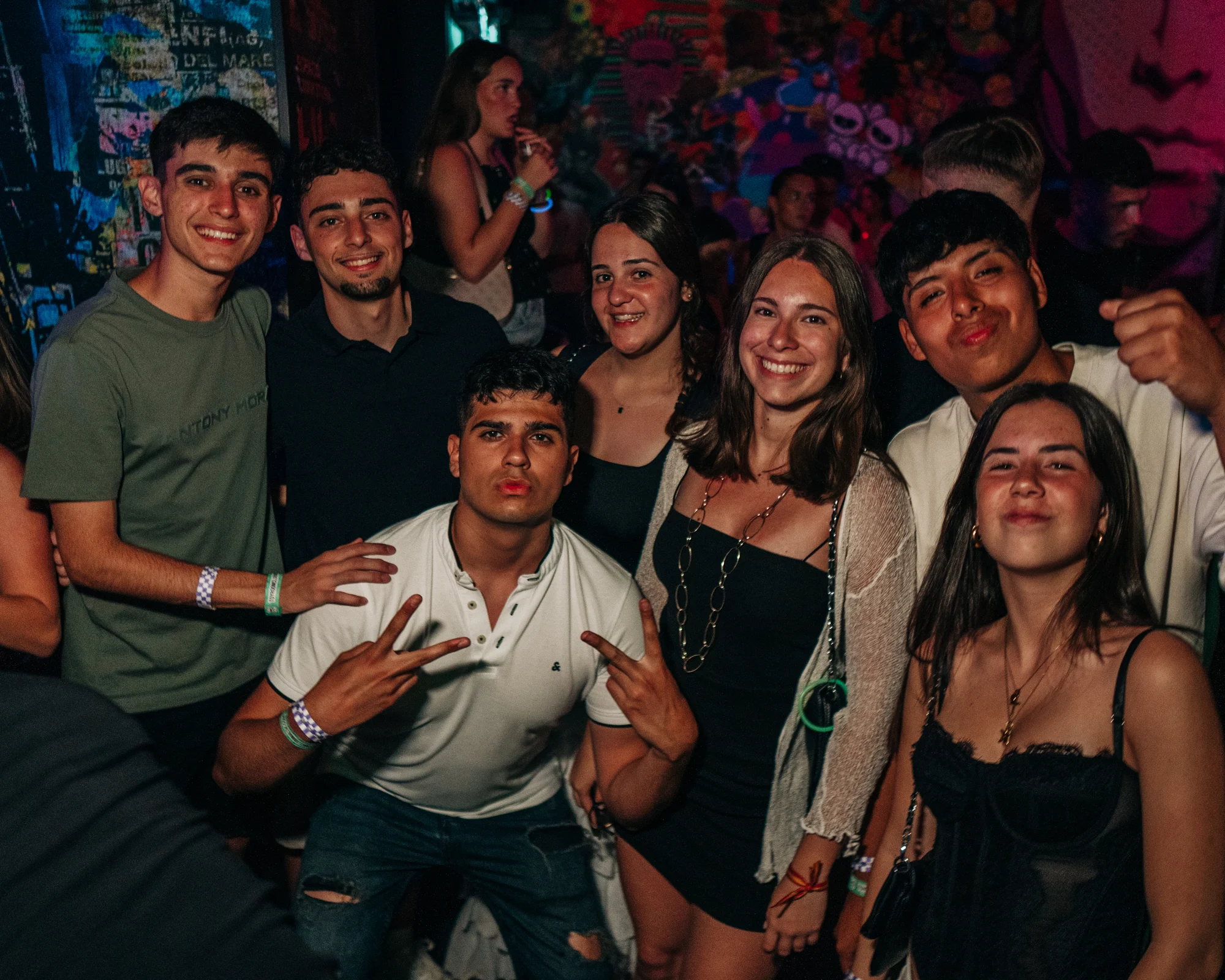 Lads and girls posing together at a Malta club night